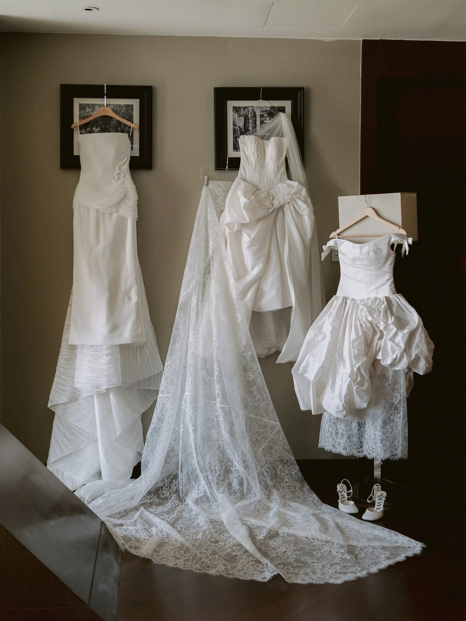 Wedding gowns and a lace veil laid out before the ceremony