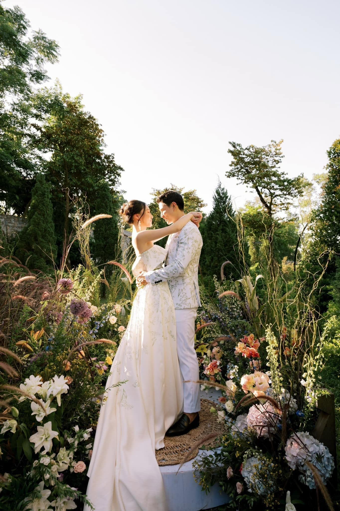 A garden ceremony set with linen-draped chairs under soft morning light