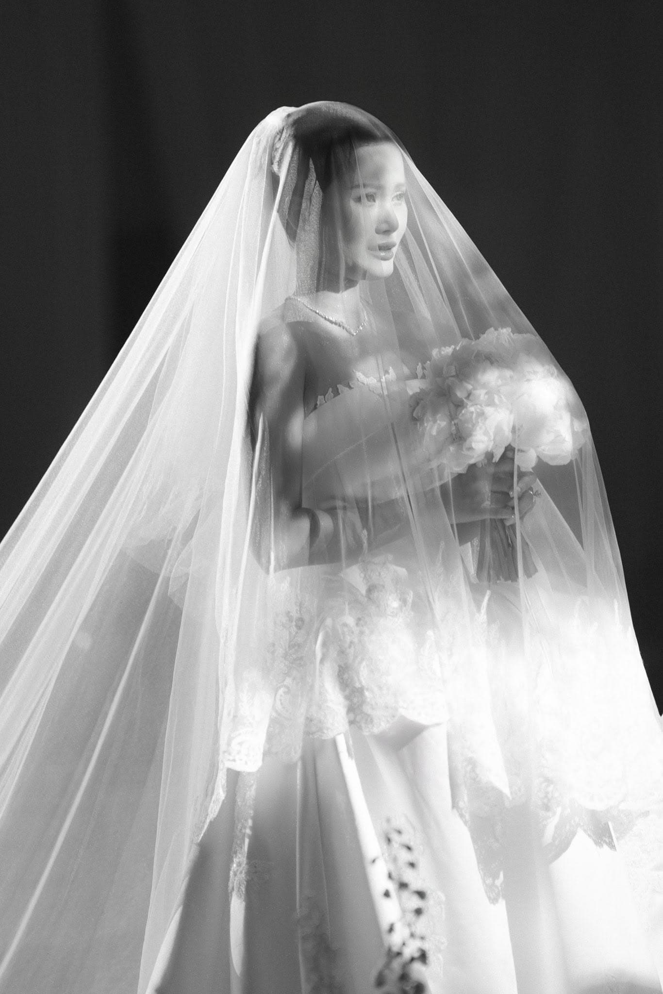 Bride beneath a veil