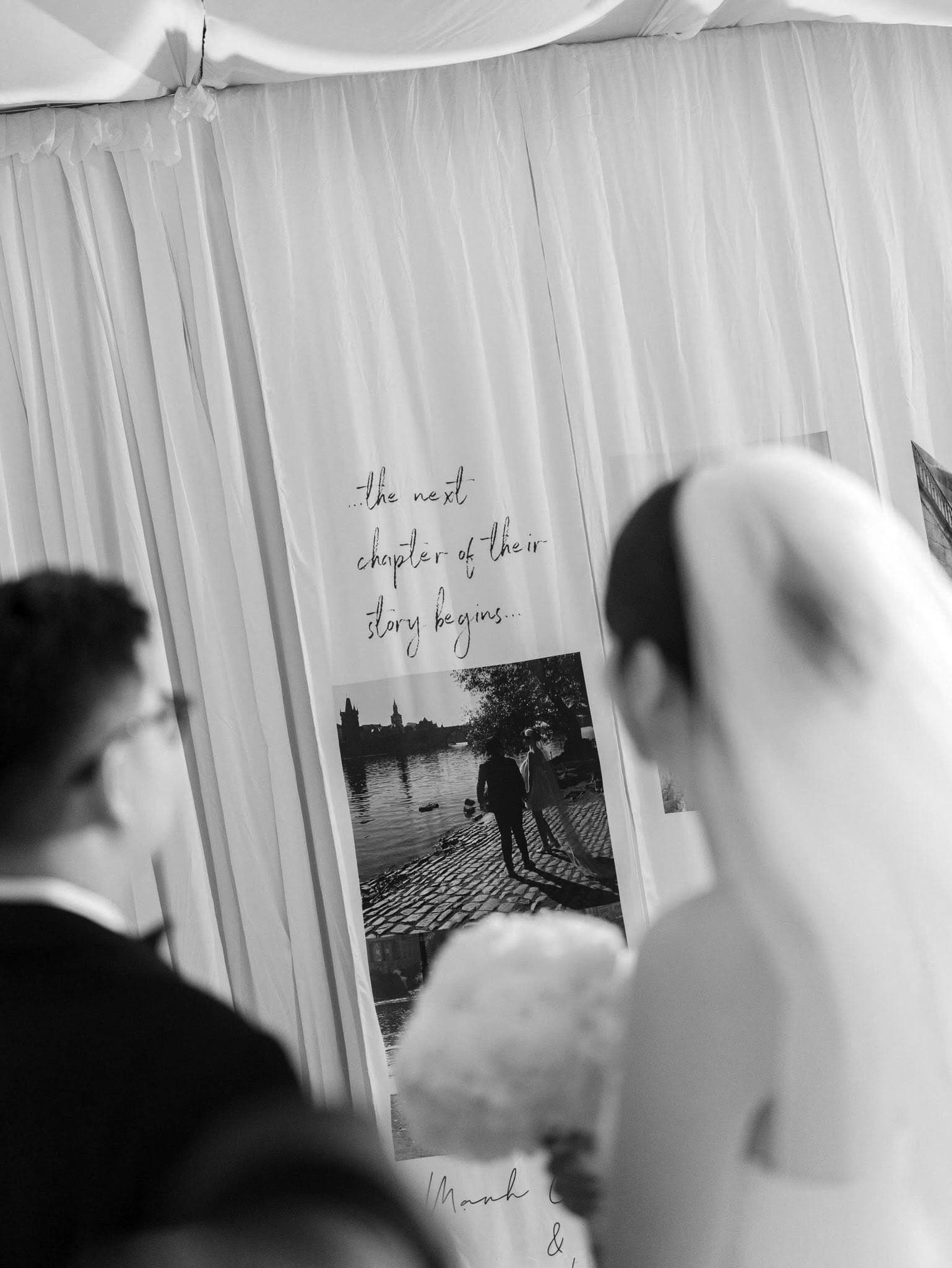 The couple before the ceremony backdrop